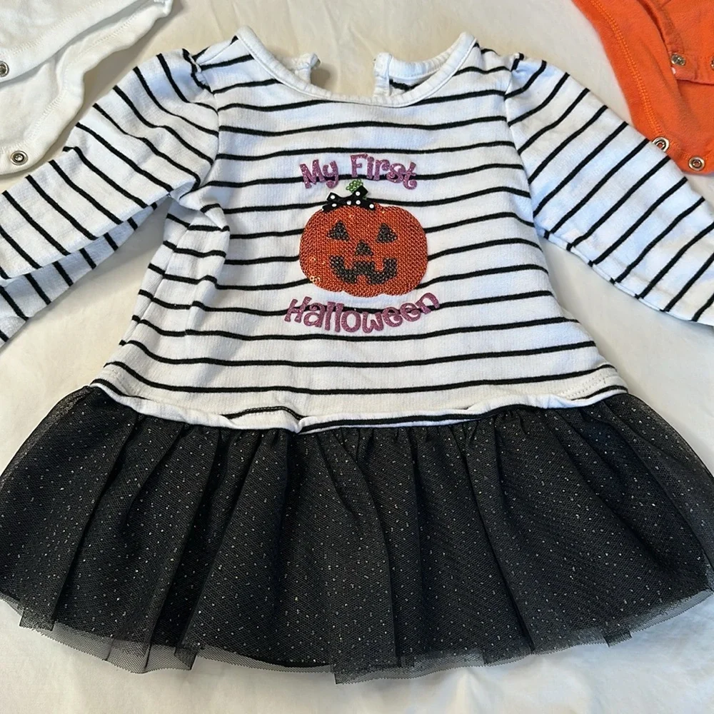 Bundle of my first Halloween clothes. Two long sleeve onesies and a tutu shirt.
